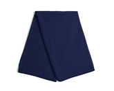 The Van Pelt Blanket: Heathered Navy, a quilted textile featuring diamond-stitch texture and finished edges, ideal for cozying up by the firepit or relaxing at home.