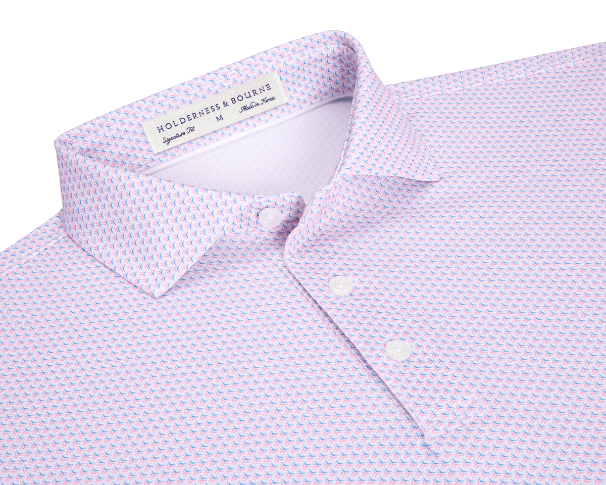 The Lennox Shirt: Belmont & Horizon Blue, featuring a light pink base with a blue-and-pink geometric pattern, structured collar, and Holderness & Bourne branding.