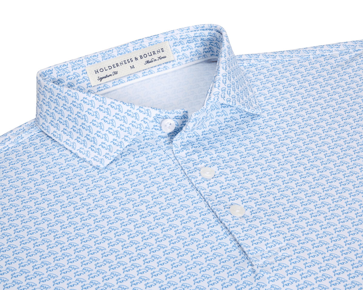 The Berkeley Shirt: Maidstone Blue, featuring a light-blue bull-and-bear pattern, spread collar, and signature fit, crafted from soft performance jersey with label visible.