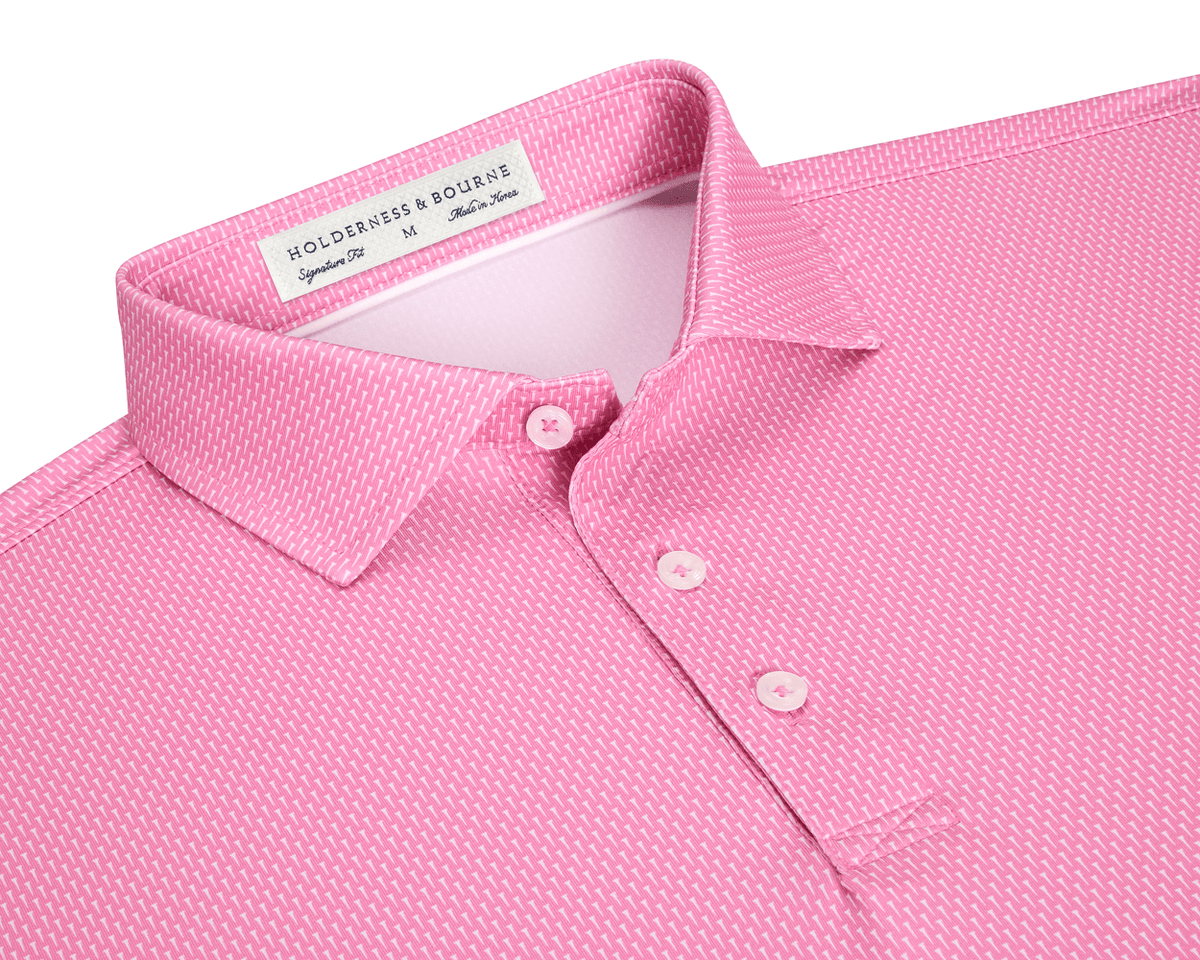 The Hicks Shirt: Belmont features a geometric golf-tee pattern, three-button placket, and structured collar, crafted for performance with moisture wicking and UPF 50+ protection.