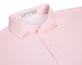 The Hanover Shirt: Nectarine features a geometric print, three-button placket, and a structured spread collar, offering performance with moisture wicking and UPF 50+ protection.