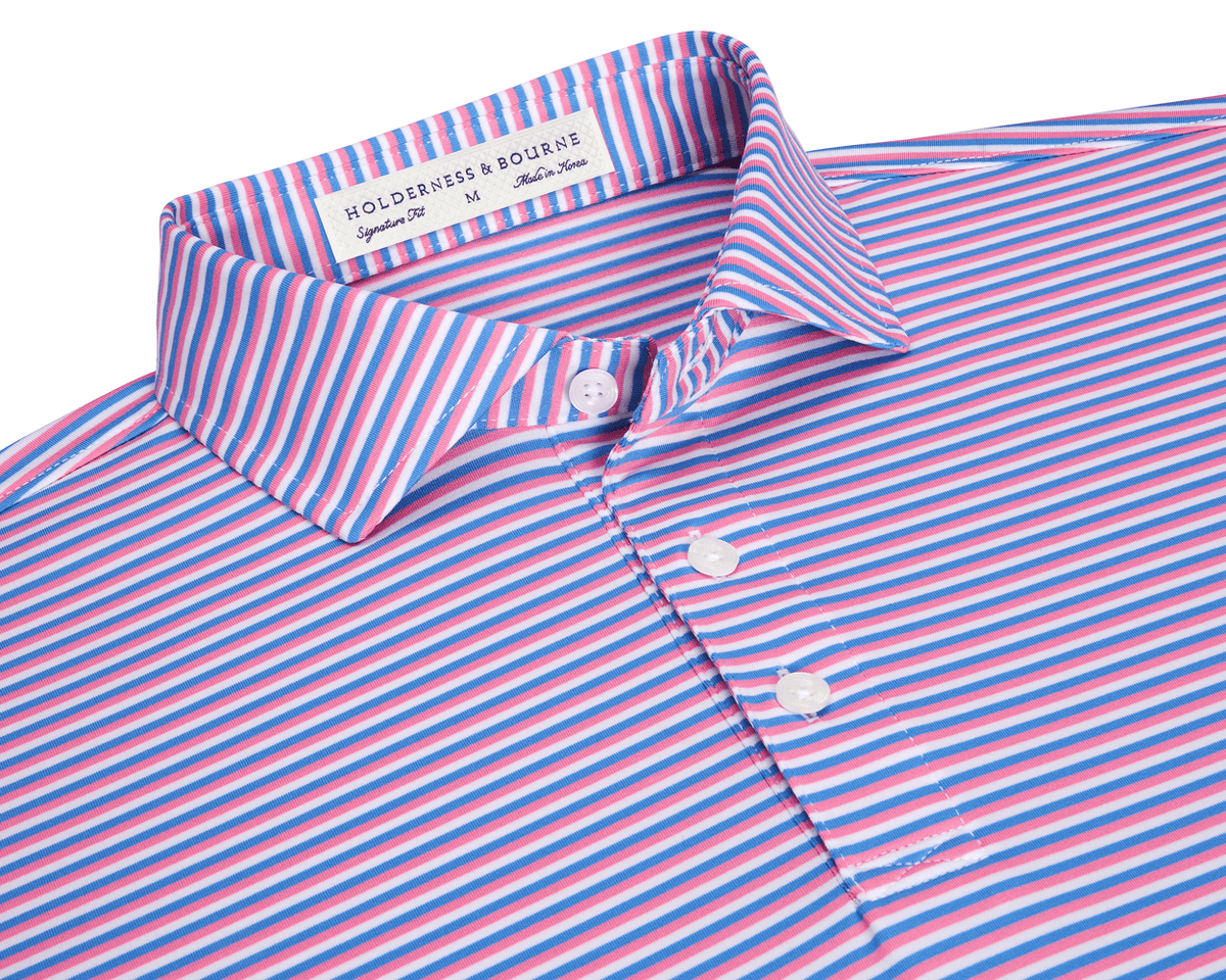 The Fleming Shirt: Horizon Blue/Belmont/White, a folded polo with narrow stripes, three-button placket, spread collar, and Holderness & Bourne neck label, offering stretch and sun protection.