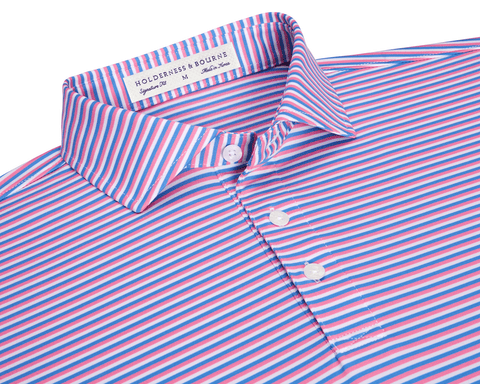 The Fleming Shirt: Horizon Blue/Belmont/White, a folded polo with narrow stripes, three-button placket, spread collar, and Holderness & Bourne neck label, offering stretch and sun protection.