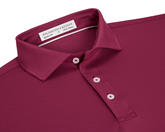 Close-up of The Macdonald Shirt: Cabernet, showcasing a structured spread collar, three-button placket, and contrast collar band piping, featuring the Holderness & Bourne woven label.