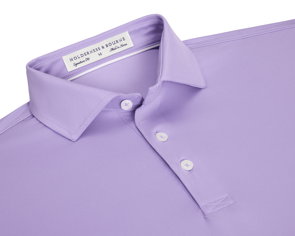 The Anderson Shirt: Tudor, a lavender collared polo with a three-button placket and white buttons, crafted for comfort with jersey knit performance fabric.