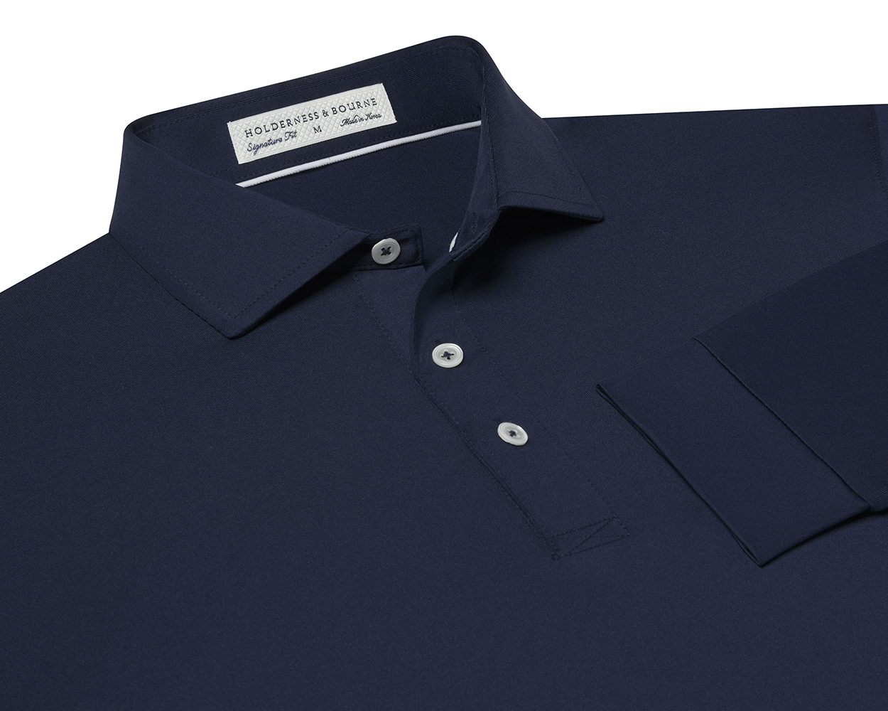 The Farrell Shirt: Navy, long-sleeve polo with a button placket, spread collar, and moisture-wicking jersey knit. Features include a label reading Holderness & Bourne, Signature Fit.