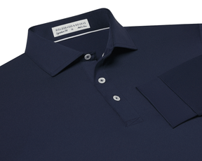 The Farrell Shirt: Navy, long-sleeve polo with a button placket, spread collar, and moisture-wicking jersey knit. Features include a label reading Holderness & Bourne, Signature Fit.