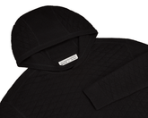 The Wallace Hoodie Sweater: Black features a quilted knit, ribbed hood and cuffs, and a label reading “Holderness & Bourne, Signature Fit, M.”
