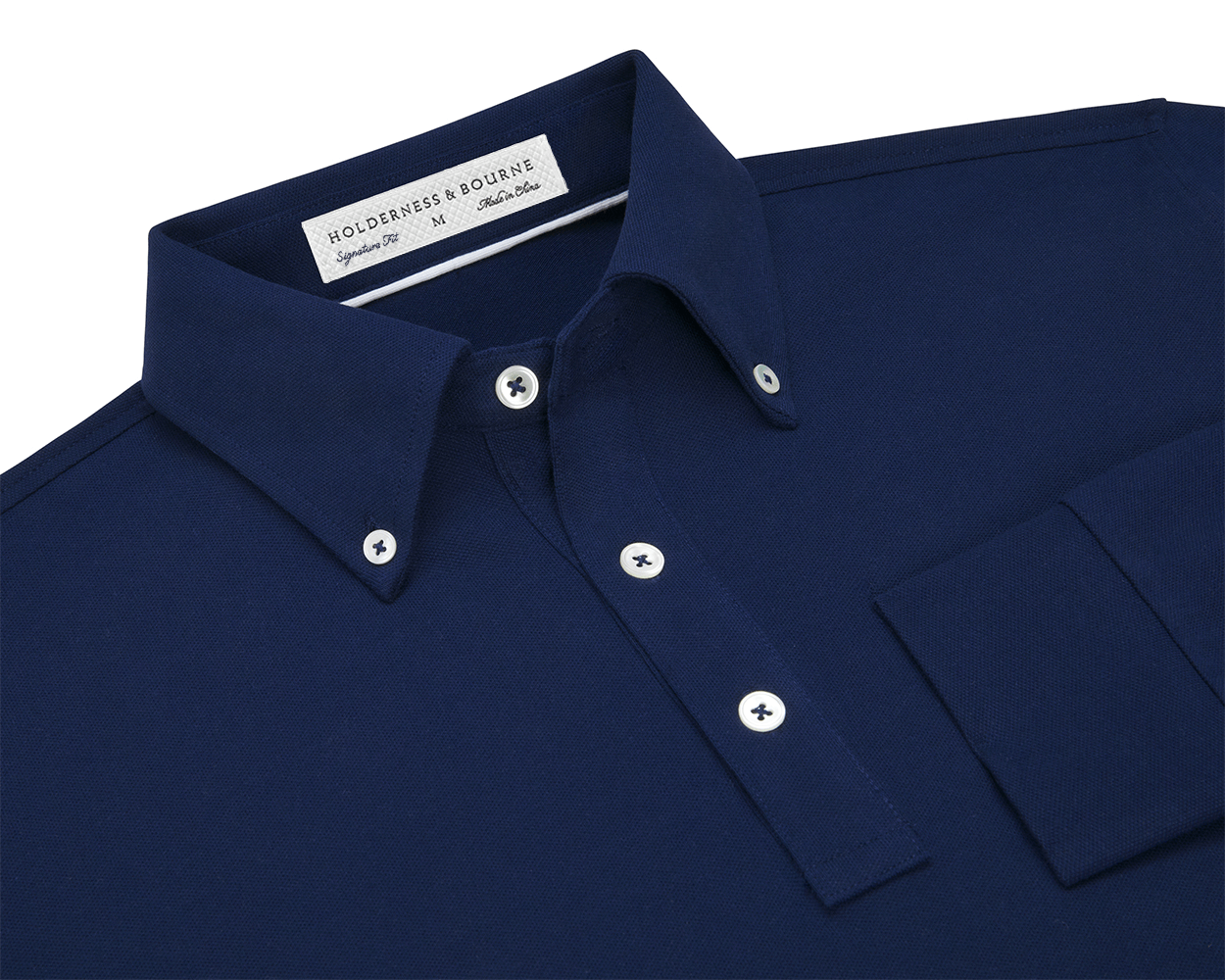 The Burton Shirt: Navy, featuring a button-down collar and white buttons, offers a refined look with its cotton-elastane pique knit and stretch ribbed cuffs.