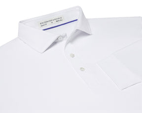 The Farrell Shirt: White, featuring a polo-style button-front, spread collar, two buttons, sleeve cuff, and the “Holderness & Bourne” label, showcasing performance fabric.