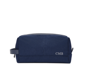 The Littler Dopp Kit: Navy Ballistic - Slate Blue Embroidery, featuring a monogram, top zipper, side handle, and water-resistant interior and exterior.