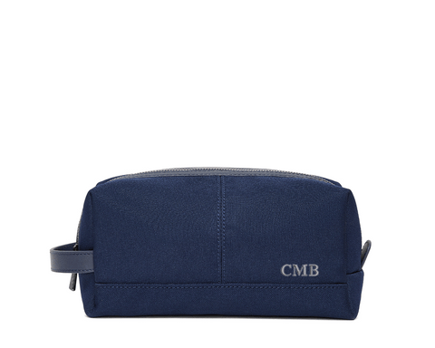 The Littler Dopp Kit: Navy Ballistic - Slate Blue Embroidery, featuring a monogram, top zipper, side handle, and water-resistant interior and exterior.