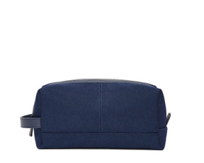 The Littler Dopp Kit: Navy Ballistic, a rectangular zippered toiletry bag with a fabric handle, features minimal stitching and a water-resistant interior pocket.