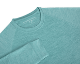 The Laidlay Crewneck: Heathered Harbor, a soft, stretchy raglan-style pullover with a heathered texture, showcasing the Holderness & Bourne neck label.