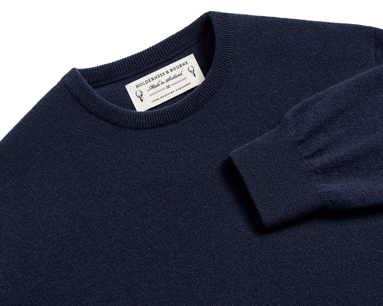 The Buckley Crewneck Sweater: Heathered Dark Navy, crafted from 100% Scottish cashmere, features a classic crewneck and durable doubled cuff design.
