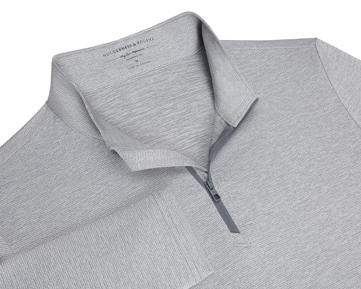 The Bell Quarter-Zip: Heathered Gray, featuring a textured knit, fold-over collar, quarter-zip placket, and long sleeves, offering sporty sophistication and versatility.
