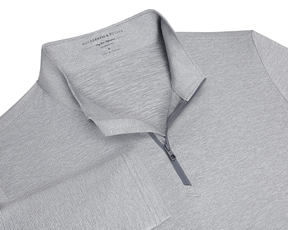 The Bell Quarter-Zip: Heathered Gray, featuring a textured knit, fold-over collar, quarter-zip placket, and long sleeves, offering sporty sophistication and versatility.