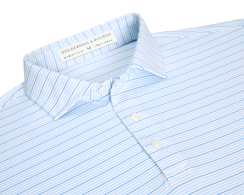 The Stanley Shirt in light-blue stripes, features a three-button placket and structured collar. Made from breathable AIRATION® fabric with micro perforations for enhanced comfort.
