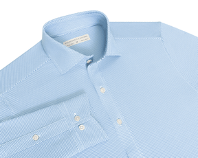 The Goodrich Shirt: Horizon Blue, light-blue button-up with a subtle woven pattern, point collar, white buttons, and breathable Swing Knit® fabric for versatile wear.