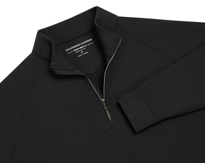 The Westland Quarter-Zip: Black, features a black long-sleeve design with a stand-up collar and quarter-zip, showcasing Holderness & Bourne's signature fit label.