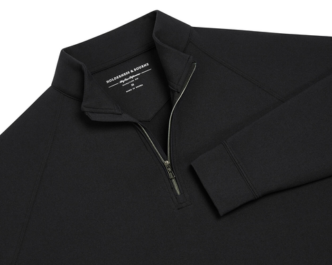 The Westland Quarter-Zip: Black, features a black long-sleeve design with a stand-up collar and quarter-zip, showcasing Holderness & Bourne's signature fit label.