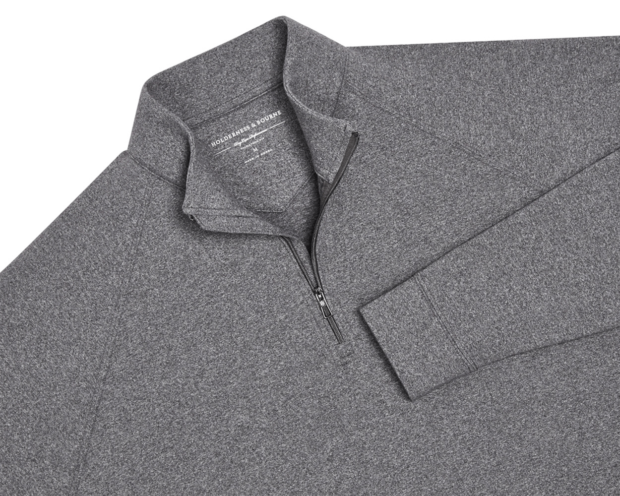 The Westland Quarter-Zip: Charcoal, featuring a heather-gray design with a quarter-zip and standing collar, offers moisture-wicking comfort and visible shoulder stitching.