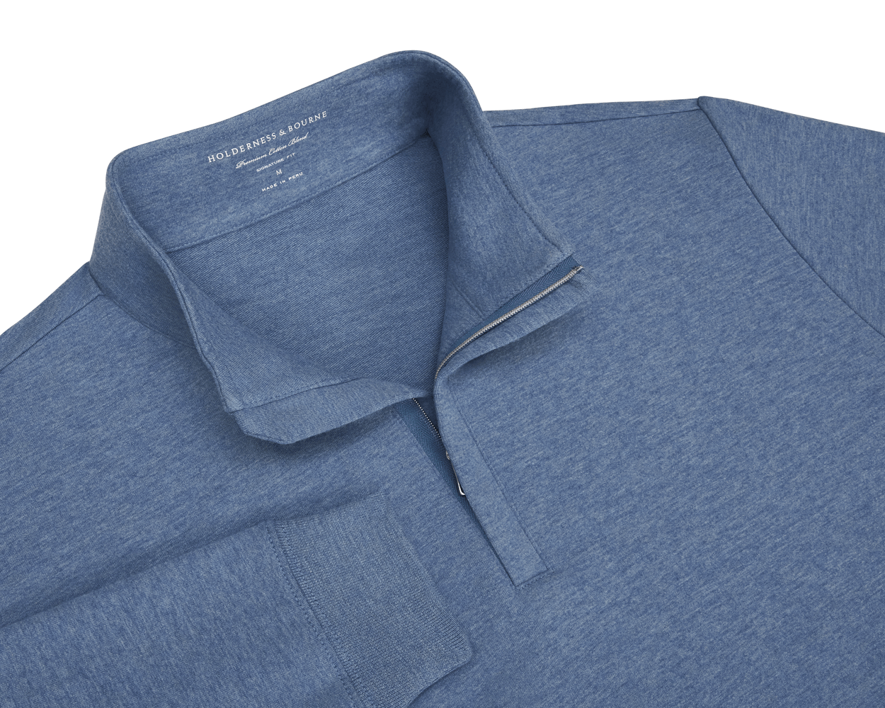 The Harper Quarter-Zip: Heathered Bedford, a blue long-sleeve pullover with a quarter-zip, features a soft cotton-blend knit and ribbed cuffs for comfort.