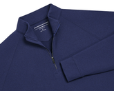 The Westland Quarter-Zip: Navy, features a dark-blue, long-sleeve design with gunmetal chrome trim, offering moisture-wicking performance and a soft, peached synthetic blend.