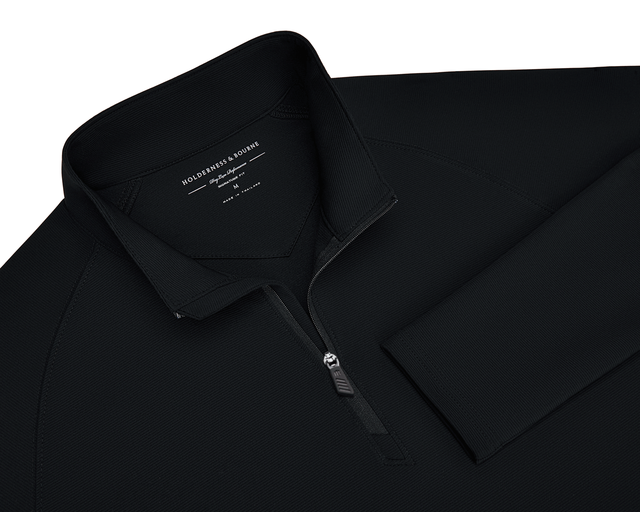 The Stuart Quarter-Zip: Black pullover with a ribbed texture, standing collar, and logo zipper. Features a soft interior and Holderness & Bourne label.