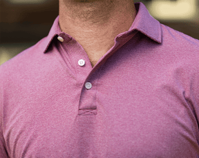 Lifestyle close-up of a model wearing The Holland Shirt: Heathered Napa outdoors, showing the spread collar, buttoned placket, and fine heathered stripes.