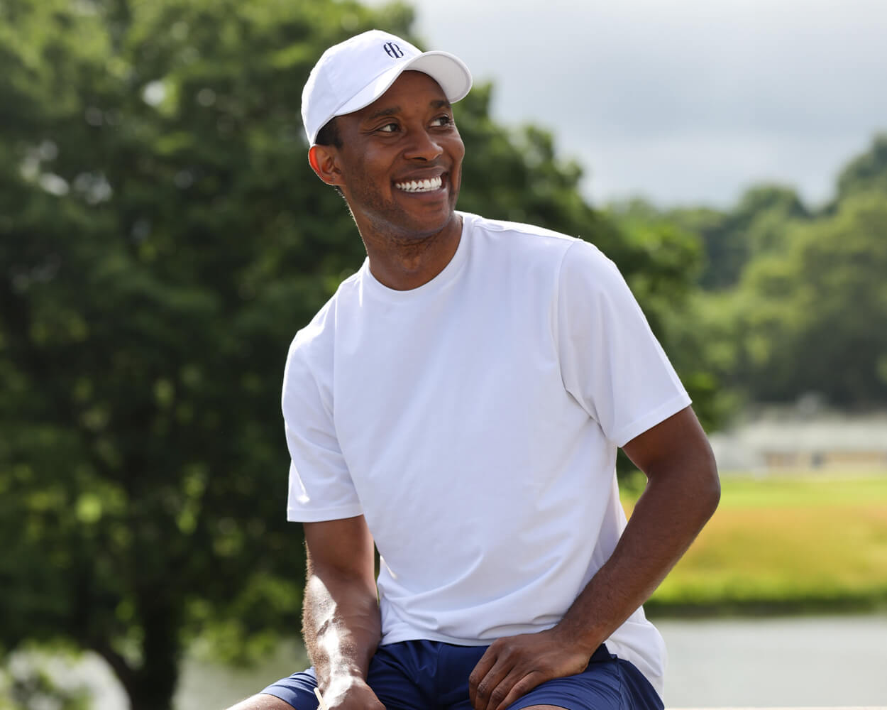 Man wearing Holderness & Bourne Men’s Pima Cotton White T-Shirt with white hat