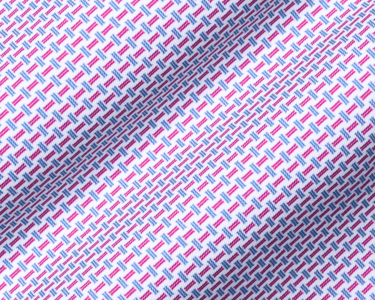 Close-up of the 2026 U.S. Open Norman Shirt, showcasing its white fabric with magenta and light-blue geometric dashes.