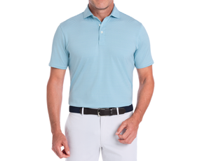The Perkins Shirt: Harbor & White, featuring a light-blue striped design, worn with white pants and a dark woven belt, highlighting its signature fit and performance fabric.