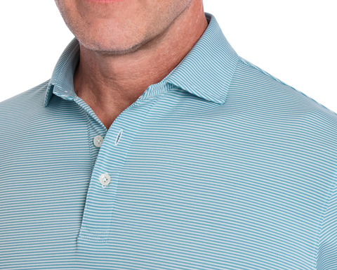 The Perkins Shirt: Harbor & White, featuring a light-blue polo with thin white stripes, two buttons, and a structured collar, ideal for versatile comfort and style.