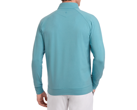 Back view of The Westland Quarter-Zip: Heathered Harbor, showcasing its light teal, lightweight performance fabric with a subtle collar logo, perfect for versatile wear.