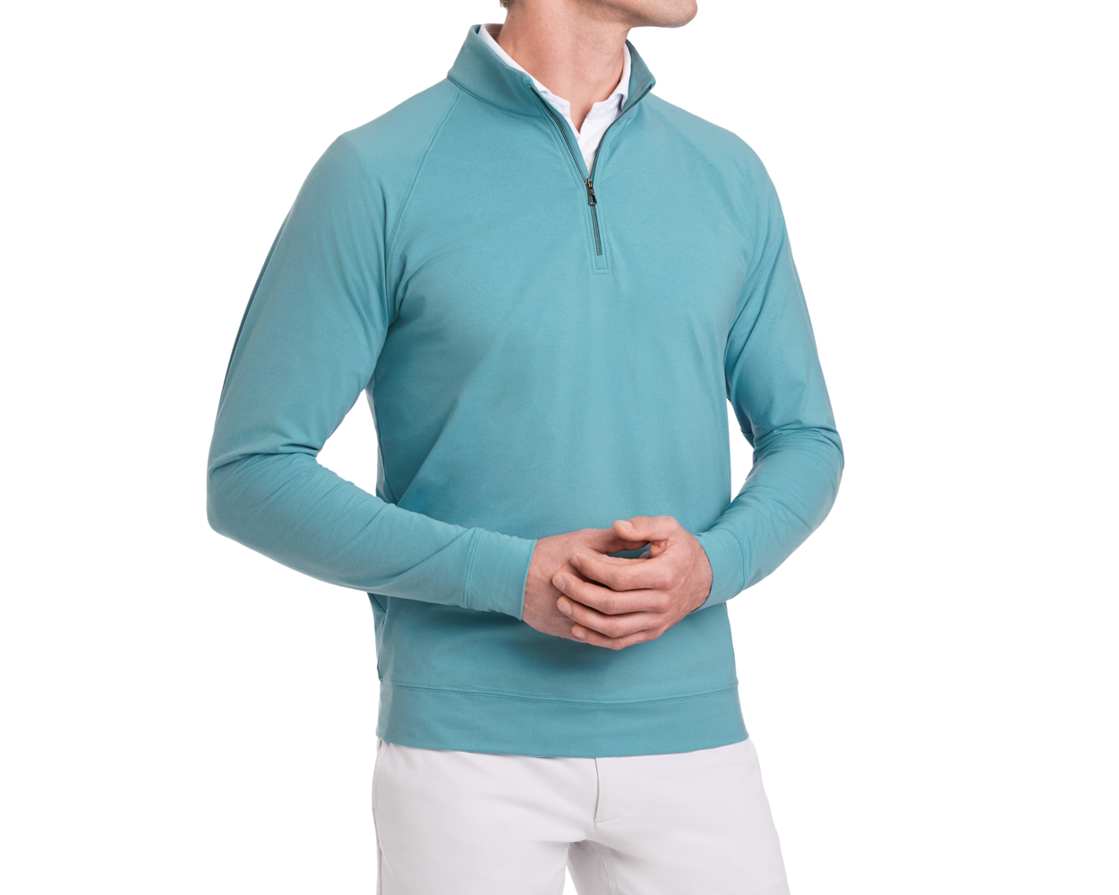 The Westland Quarter-Zip: Heathered Harbor, shown on a model wearing a white shirt and pants, highlights its sleek design and soft, moisture-wicking fabric.
