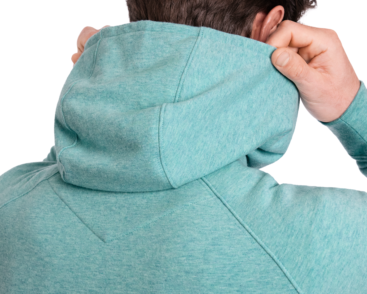 The Lawson Hoodie: Heathered Harbor, worn by a person adjusting the hood, showcases an ultra-soft, detail-free design ideal for both casual and active settings.
