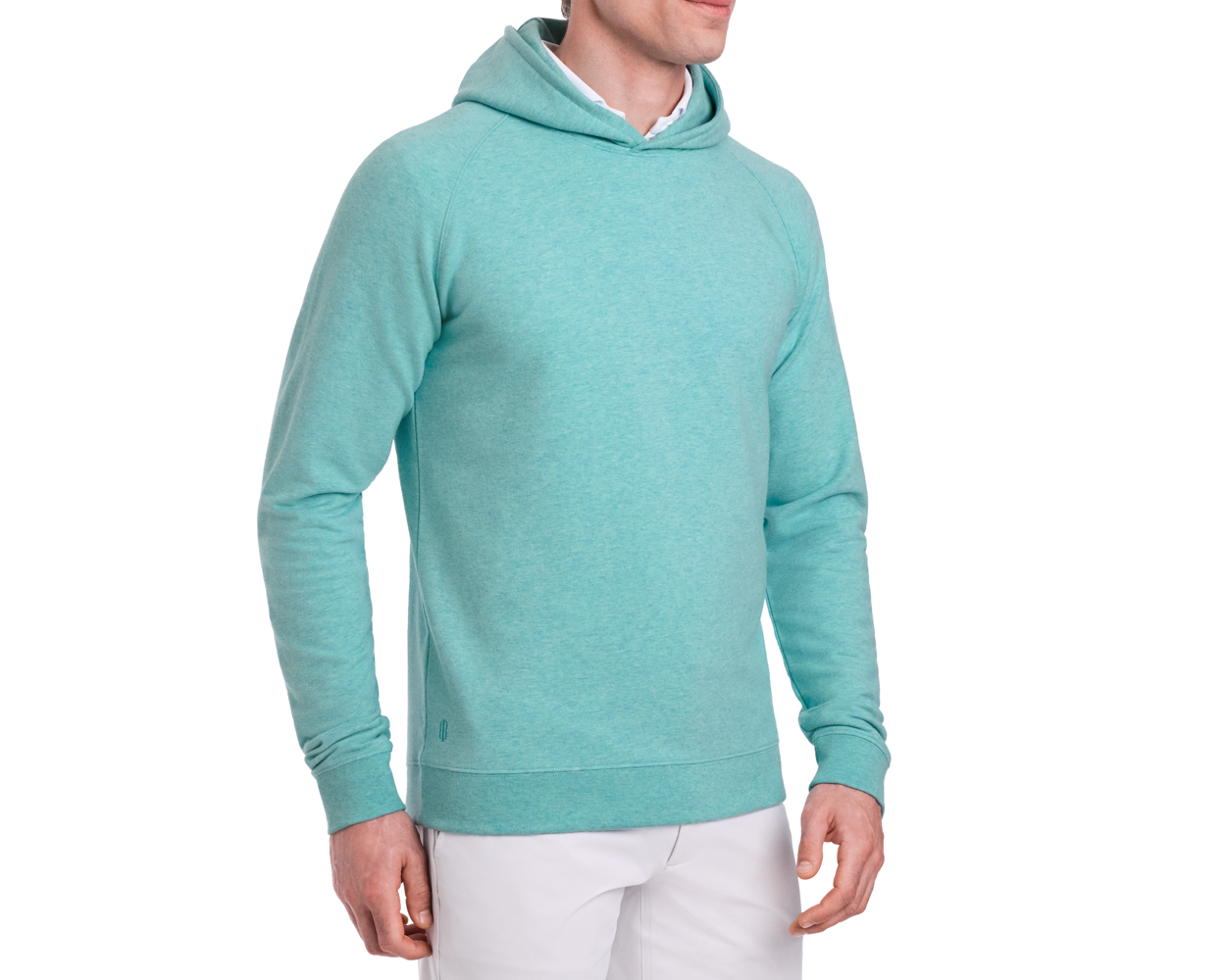 Person wearing The Lawson Hoodie: Heathered Harbor, a long-sleeve, hooded pullover without drawstrings, paired with off-white pants, set against a plain background.