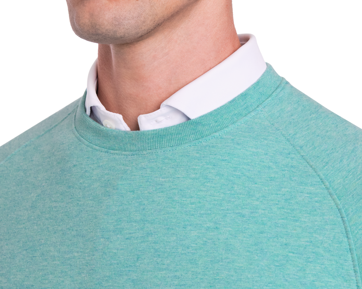 The Kennedy Crewneck: Heathered Harbor layered over a white shirt, showcasing a plush terry interior and performance fit for versatile, year-round comfort.