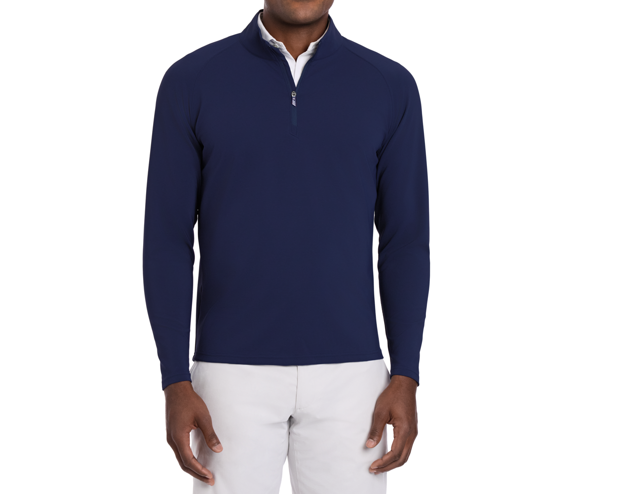 Person wearing The Stuart Quarter-Zip: Navy, showcasing its textured rib fabric over a white shirt, paired with light-grey pants, highlighting versatility and softness.