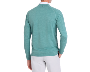 Model wearing The Laidlay Crewneck: Heathered Harbor, showcasing the back view of the teal-green pullover over a white shirt, paired with light-gray pants.