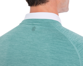 Close-up of The Laidlay Crewneck: Heathered Harbor, showcasing the heathered polo-style shirt with contrasting white collar and logo below the collar.
