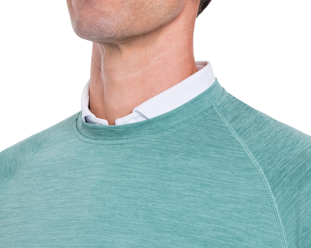 The Laidlay Crewneck: Heathered Harbor shown on a person, highlighting its heathered texture and soft, stretchy fit, complementing a white collared shirt underneath.