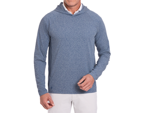 The Dunbar Hoodie: Heathered Andover, shown with a white shirt, offers AIRATION® technology for breathability and UPF 50+ protection, styled with beige pants.