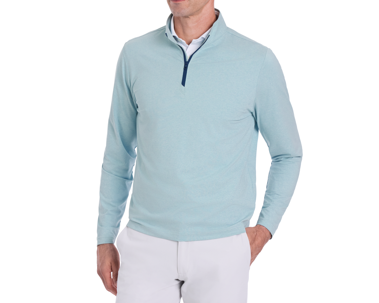 The Bell Quarter-Zip: Heathered Harbor, showcasing a light-blue pullover with a quarter-zip, layered over a white shirt, paired with light-gray trousers.