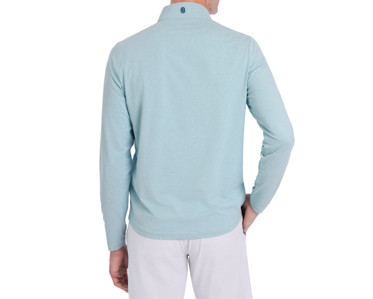 Person in The Bell Quarter-Zip: Heathered Harbor, showcasing back view with logo on collar, left hand on hip, in a modern drop-tail silhouette.