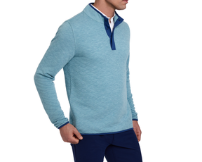 The Sullivan Quarter-Snap: Heathered Harbor pullover with quilted texture, navy trim, over a white shirt, paired with navy trousers, showcases casual style and warmth.
