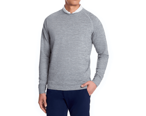 Man modeling The Laidlay Crewneck: Heathered Gray, featuring a heathered texture over a white collared shirt, paired with dark navy pants.