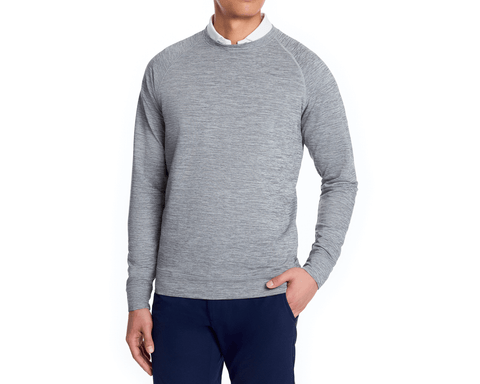 Man modeling The Laidlay Crewneck: Heathered Gray, featuring a heathered texture over a white collared shirt, paired with dark navy pants.