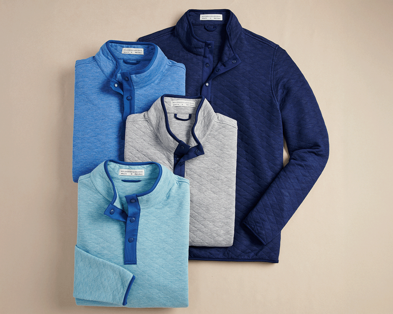 The Sullivan Quarter-Snap: Heathered Maidstone Blue, a quilted jersey pullover with snap-button collar, offers soft insulation and classic styling for versatile wear.
